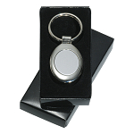 Oval satin and polished metal key ring in a black box 3