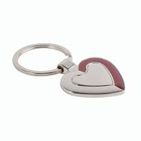 Heart-shaped metal key ring with shimmering colour detail on one side in a black box